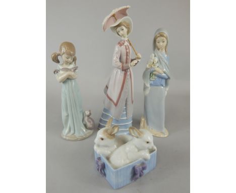 Four Spanish porcelain figures, a Lladro figure of a girl with cats, a Lladro figure of a lady with a parasol, one carrying l