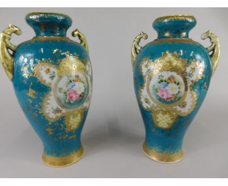 A pair of Japanese porcelain export vases, each painted with flowers on a turquoise ground, picked out in blue, unmarked, 30c