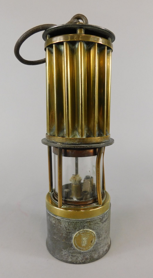A late 19thC/early 20thC brass and iron miner's lamp, made by the