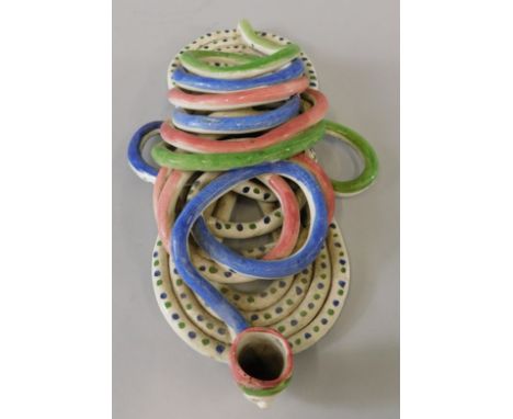 A 19thC Prattware knotted pipe, with a mask head bowl, 27cm long (AF)