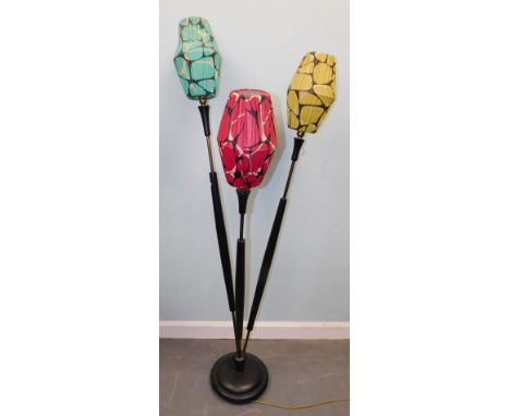 A retro style 1960's ebonised standard lamp, with three brightly coloured fabric shades, on a domed base