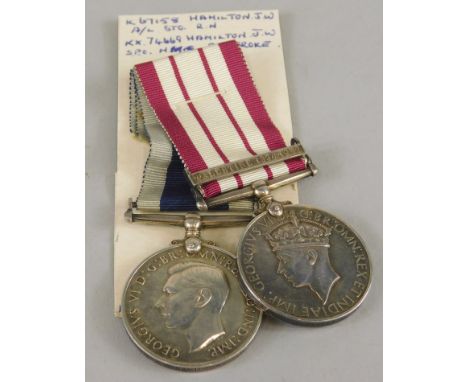 A Royal Naval medal, with bar for Palestine 1930, 1936-1939 and a Long Service & Good Conduct medal awarded to a J W Hamilton