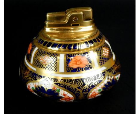 A Royal Crown Derby Old Imari pattern lighter, fashioned exclusively for Ronson, with purple stamped underside, 9cm high.