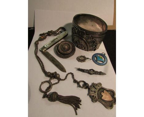 A double-strand rope chain spaced with chased balls and an enamelled panel and terminating in a tassel and escutcheon pendant