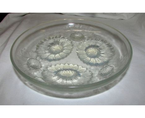 A moulded opalescent glass bowl with six flower heads, moulded mark 'R. LALIQUE. FRANCE' and etched 'no. 395', diameter 22cm