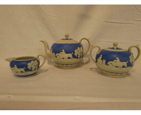 A Copeland late Spode blue ground pate sur pate three-part tea set decorated with hunting scenes, transfer mark and stamps to