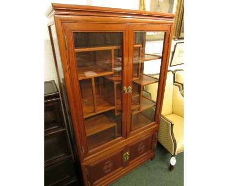 Modern Chinese-style display cabinet, the upper glazed section with geometric shelf staging behind the two doors, with two do