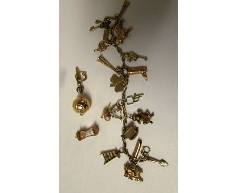 9ct gold charm bracelet attached with sixteen charms (of which eleven are stamped 375 or 9ct), and three loose charms (total 