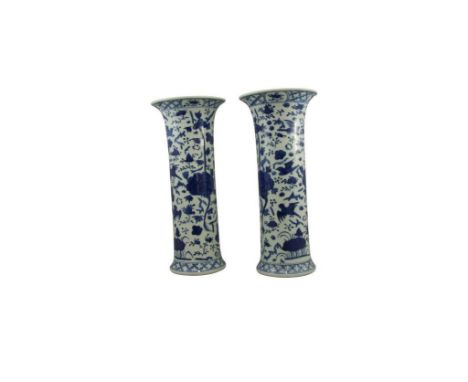 the flared rim leading to a cylindrical body and terminating in a flared foot, painted in underglazed blue with bird and foli