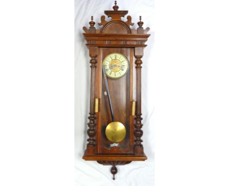 Viennese regulator wall clock, in mahogany frame the gilt metal and enamel dial with Roman numerals, pendulum and two weights