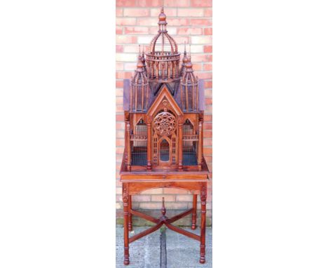 Decorative Cathedral birdcage, hardwood and metal, on stand with carved supports the x stretcher with urn finial, 2009 x 69 x