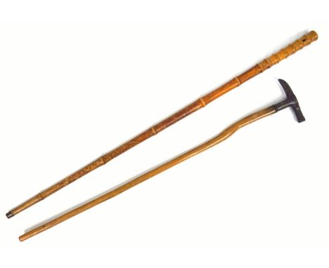 Antique Sword stick in turned wood, faux bamboo case, C. 1880, length 96 cm, and a cast iron ice pick handled walking cane, 7