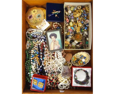 A large quantity of vintage costume jewellery,  earrings, necklaces, enamel bird broach, and a London themed oversize compact