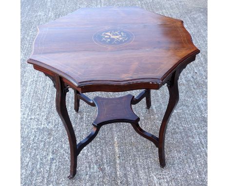 Late Victorian rosewood lamp table, of shaped octagonal form inlaid with design of musical instruments, satinwood banding cur