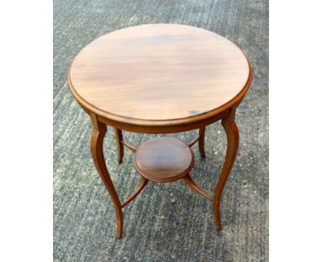 A Edwardian circular lamp table with undertier, carved oval side table on barley twist legs and a nest of three tables.