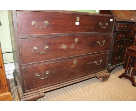A 19TH CENTURY MAHOGANY FINISHED GRADUATING THREE DRAWER CHEST, supported on bracket feet 