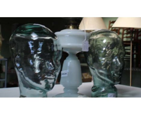 TWO MODERN BLOWN GLASS DISPLAY HEADS together with a milk glass columned oil lamp and shade 