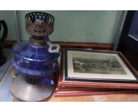 A BLUE GLASS &amp; METAL OIL LAMP together with a carved wooden tray and a small selection of prints 