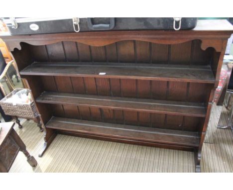 AN OAK FINISHED THREE SHELF DRESSER BACK 