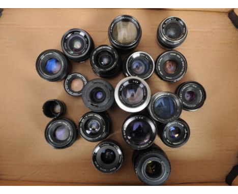 A Tray of Prime Lenses, more than 12 lenses from various brands including Canon, Fujinon, Hanimex, Olympus and Minolta,  