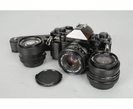 A Canon A-1 SLR Camera, serial no. 772389, body G, baseplate scratches, shutter working, meter responds to light, an FD 50mm 