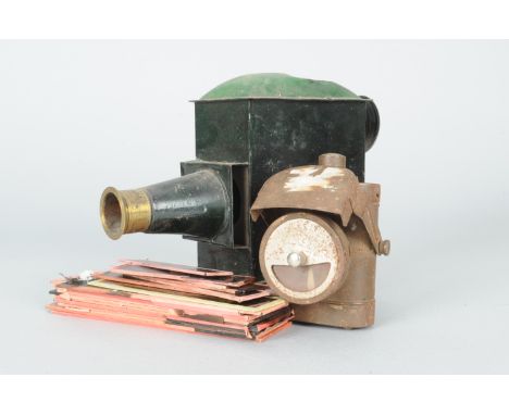 A Toy Magic Lantern, a 19th century tinplate lantern, partly repainted in green, with loose glass components, a loose oil bur