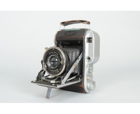 An Ensign 220 Auto-Range Folding Camera serial no. K 9935, coupled rangefinder, body F-G, Compur shutter working, with a Carl