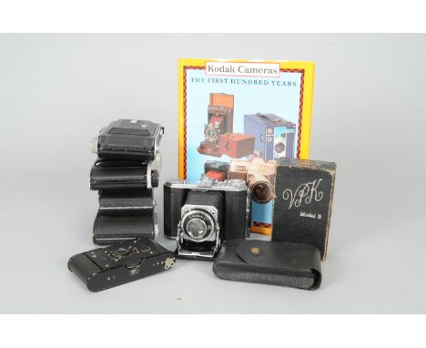 A Tray of Kodak Folding Cameras, comprising a No. 1 Autographic Kodak Jr., a Kodak Duo 620, a Kodak 620, a Vest Pocket Kodak,
