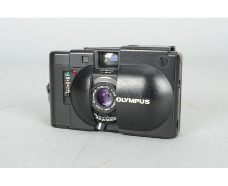 An Olympus XA Compact Rangefinder Camera, body F, some corrosion to bottom edge of film door, shutter working, meter reacts t