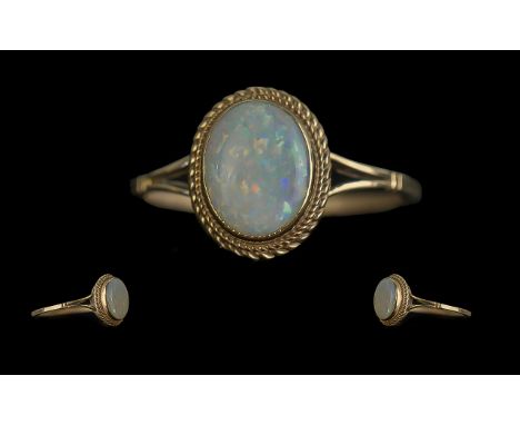 Ladies Attractive 9ct Gold Single Stone Opal Set Ring. Full Hallmark to Shank. The Oval Shaped Opal of Good Colour. Ring Size