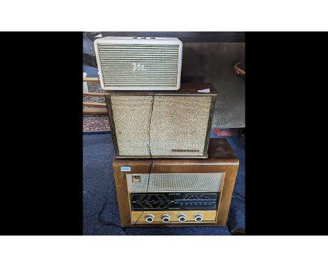 Vintage Oak Cased Bush Radio 15'' high x 20'' wide x 8'' deep, together with a Rediffusion speaker 10.5'' x 15'' x 8'' and a 