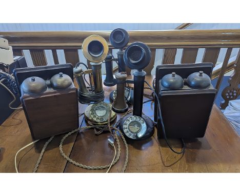 Traditional Candlestick Telephones. Two black, and one brass. The candlestick telephone (or pole telephone) is a style of tel
