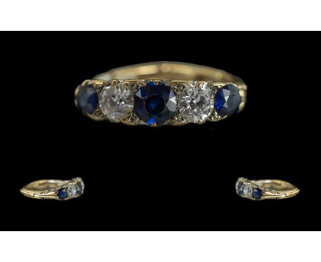 18ct Gold Attractive 5 Stone Blue Sapphire &amp; Diamond Set Flexi Banded Ring.  Marked 18ct.  The round blue faceted sapphir