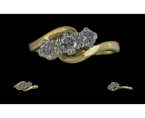 Ladies 18ct Gold Attractive and Pleasing 3 Stone Diamond Set Dress Ring. Full Hallmark to Interior of Shank. The 3 Well Match