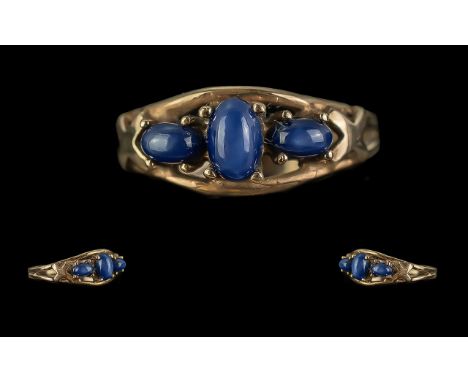 14ct Gold Pleasing Quality 3 Stone Cabochon Cut Sapphire Set Dress Ring.  The raised Sapphires of good colour.  Marked 585 - 