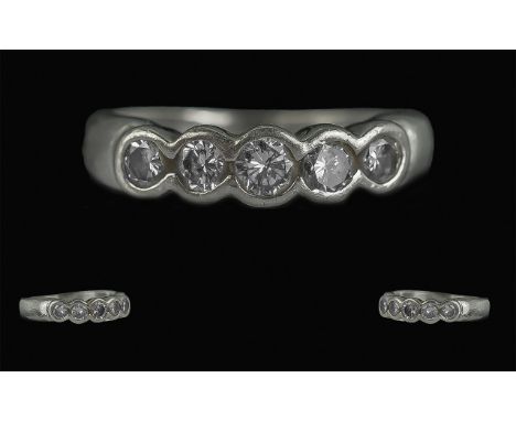 Platinum &amp; Diamond Eternity Ring, set with five brilliant cut diamonds in a rub over setting. Fully hallmarked, diamond w