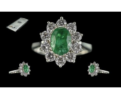 Certificated 18ct white gold oval emerald and diamond cluster ring. Emerald 1.20ct. Diamonds 1.00ct. Cert No: WGI9624126659. 