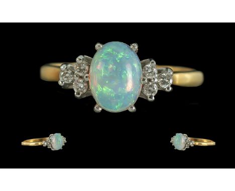 Ladies - Fine Quality 18ct Gold Opal and Diamond Set Ring. Marked 750 - 18ct to Interior of Shank. The Central Opal of Excell