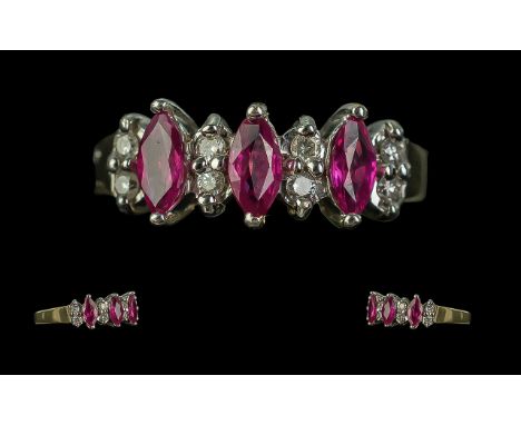 Ladies 9ct Gold Attractive Ruby and Diamond Set Ring. Full Hallmark to Interior of Shank. The Pear Shaped Rubies of Good Colo