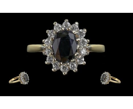 Ladies 9ct Gold Pleasing Diamond and Sapphire Set Cluster Ring. Full Hallmark to Interior of Shank. The Central Blue Sapphire