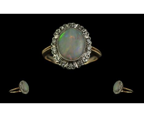 Ladies 18ct Gold Attractive Opal and Diamond Set Cluster Ring. The Central Large Opal of Good Colours, Est Weight 3.00 cts. T