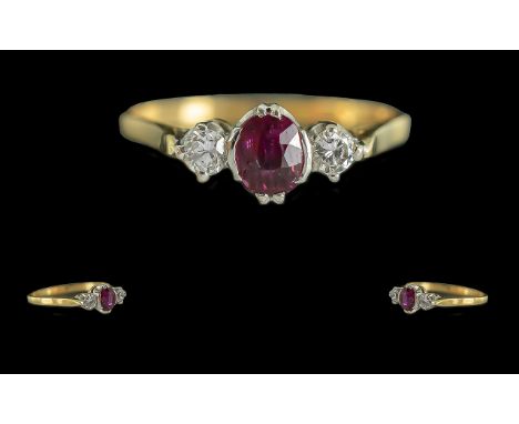 Ladies 18ct Gold Attractive 3 Stone Diamond and Ruby Set Dress Ring. Full Hallmark to Interior of Shank. The Faceted Ruby Fla