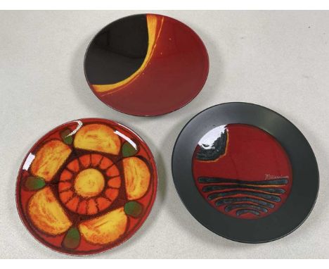 POOLE POTTERY; three plates, to include Millenium, Eclipse and Delphis, all 26cm diameter (3).