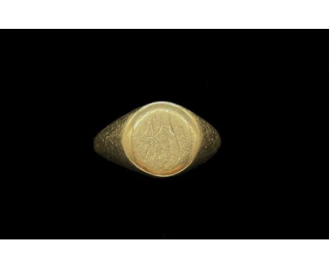A 9ct yellow gold signet ring with traces of engraved initials, size O, approx 6.22g.