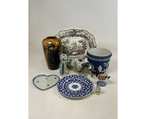 A Phoenix Ware Art Deco vase decorated with a peacock in front of a sunburst, height 31cm, together with a Wedgwood jasperwar