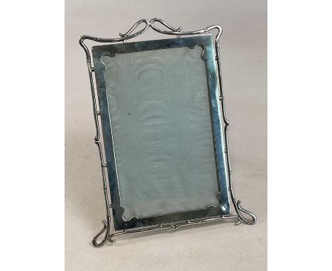 WILLIAM THOMAS BELL; a large Edwardian hallmarked silver photograph frame, with pierced shaped frame and rectangular central 