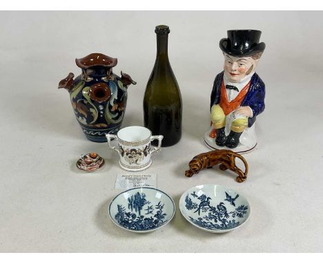 A group of ceramics, including two 18th century Worcester tea saucers, a Staffordshire lidded character jug, a Torquay potter