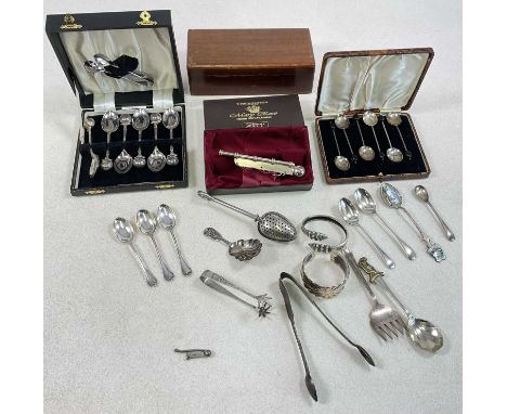 A group of small silver including an unusual Russian miniature bosun's whistle, length 40mm, a caddy spoon, three teaspoons a