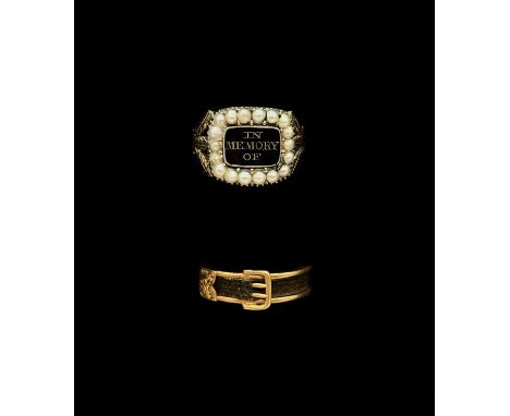 An early Victorian yellow metal and plaited hair mourning ring in the form of a belt buckle, inscribed 'In memory of my belov