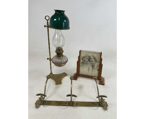An unusual brass lamp with adjustable dished sections to house both the reservoir with Hinks &amp; Son patent, and the green 
